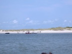 a few fishermen and some who are swimming